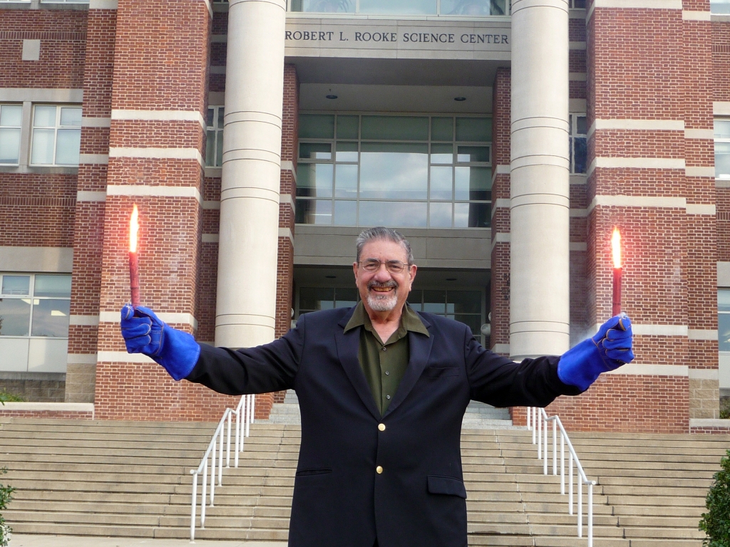 Professor Zare holding Two Flares