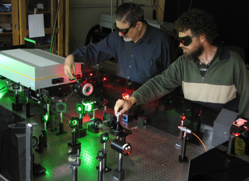 Prof. Richard Zare and Prof. John Harrison (Massey University, Auckland, New Zealand) with a two color laser setup tuned to perform stimulated Raman pumping (SRP) in deuterium gas (D2).